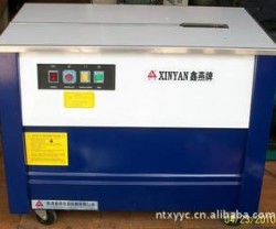 供应低台半自动打包机，广西物流快递打包机，邮政包裹打包机带图2